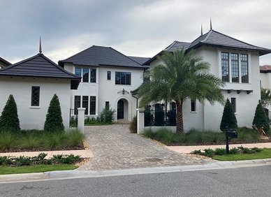 Large white two-story house with dark roof