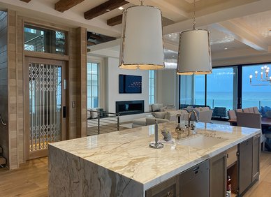 Elevator behind a kitchen island