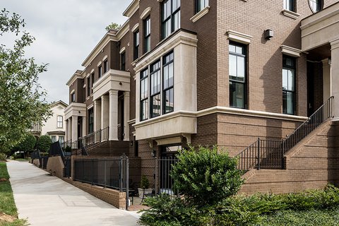 Row of modern brown-brick townhomes