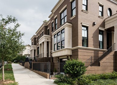 Row of modern brown-brick townhomes