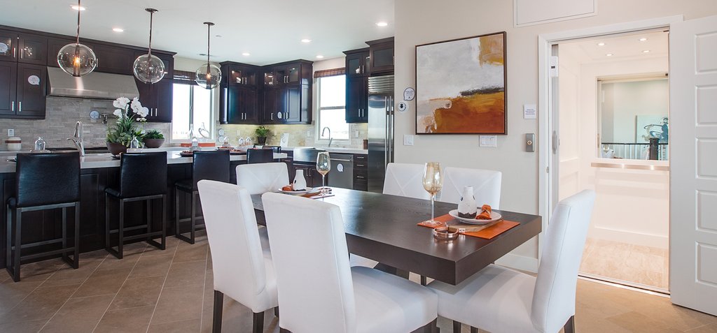 Open concept dining room and kitchen with home elevator