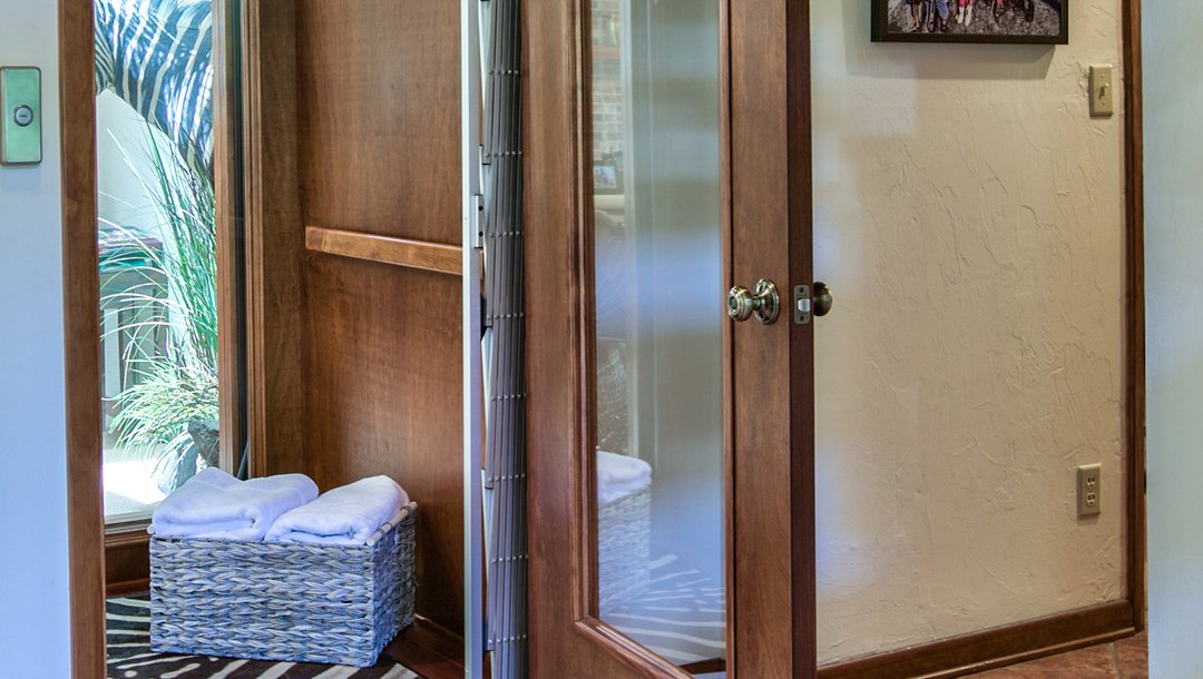Open home elevator with a basket of towels inside