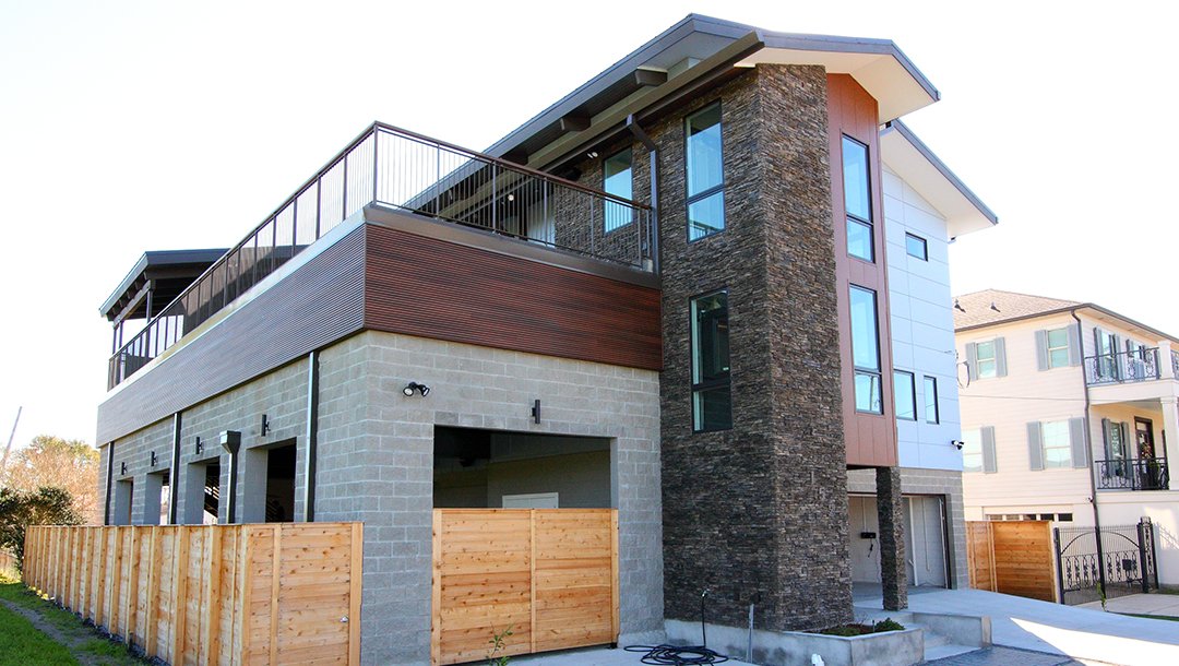 Modern two story home with stone facade