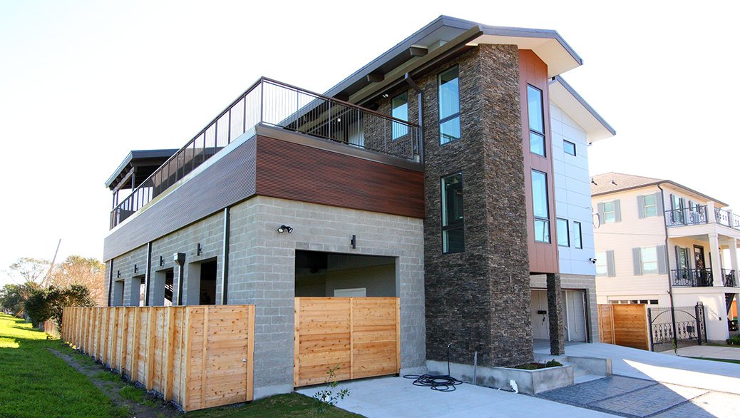 Two story modern home with stone facade