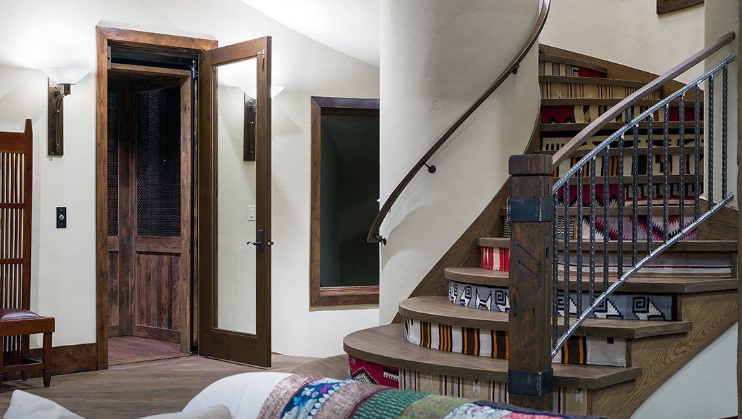 Elevator inside door at the bottom of stairway