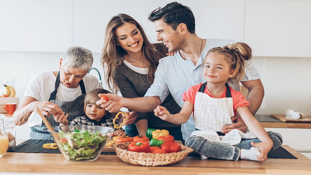 Multi generational family preparing a meal