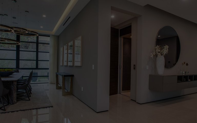 Home elevator in open concept home off of entry way