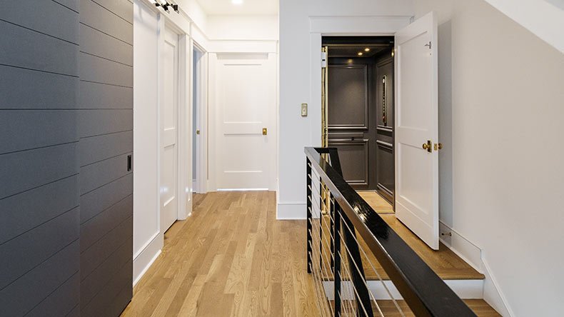 Elevator at the top of a modern staircase